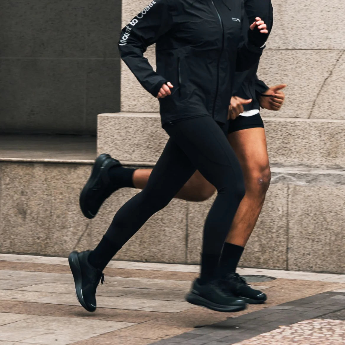 Runners in action wearing Mount to Coast gear and shoes #Color_black